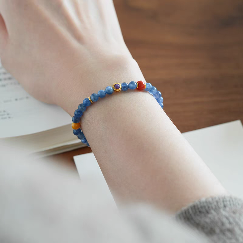 Nirvana Lumière Handmade Blue Crystal and Orange Jade Bracelet in eco-friendly packaging – Perfect gift for promoting clarity and emotional well-being.