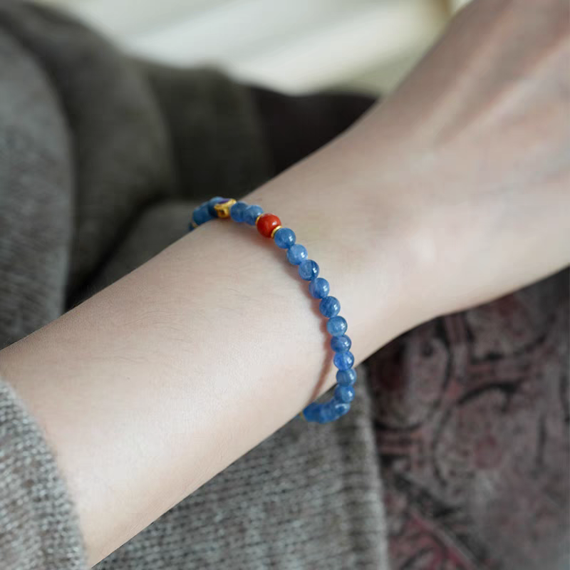 Close-up of Handmade Blue Crystal and Orange Jade Bracelet – Featuring vibrant blue crystal and orange jade beads for healing energy and clarity.