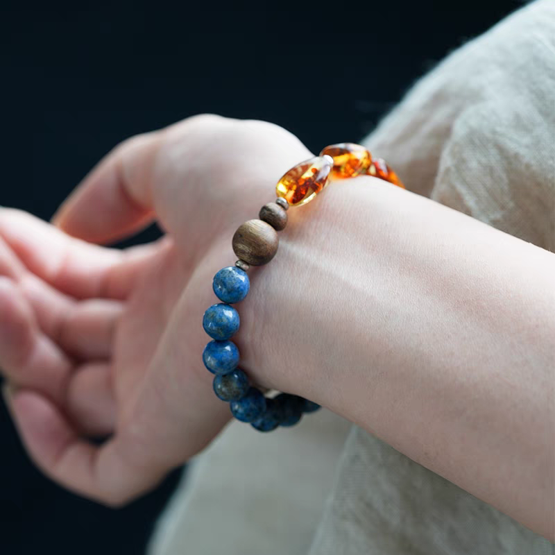 Close-up view of the Handmade Blue Crystal, Amber, and Wood Healing Bracelet – Features natural blue crystal beads, amber, and wooden accents.