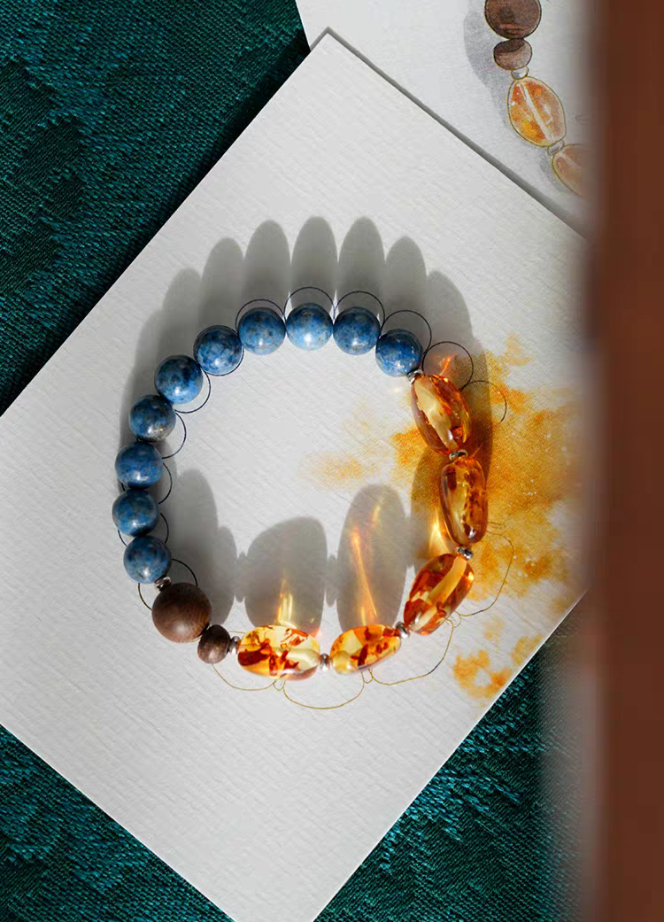 Close-up view of the Handmade Blue Crystal, Amber, and Wood Healing Bracelet – Features natural blue crystal beads, amber, and wooden accents.