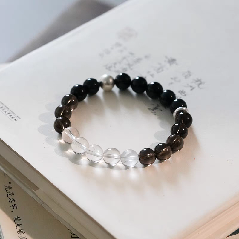 Black Tiger Eye and Crystal Healing Bracelet styled with natural stones, offering balance and positive energy