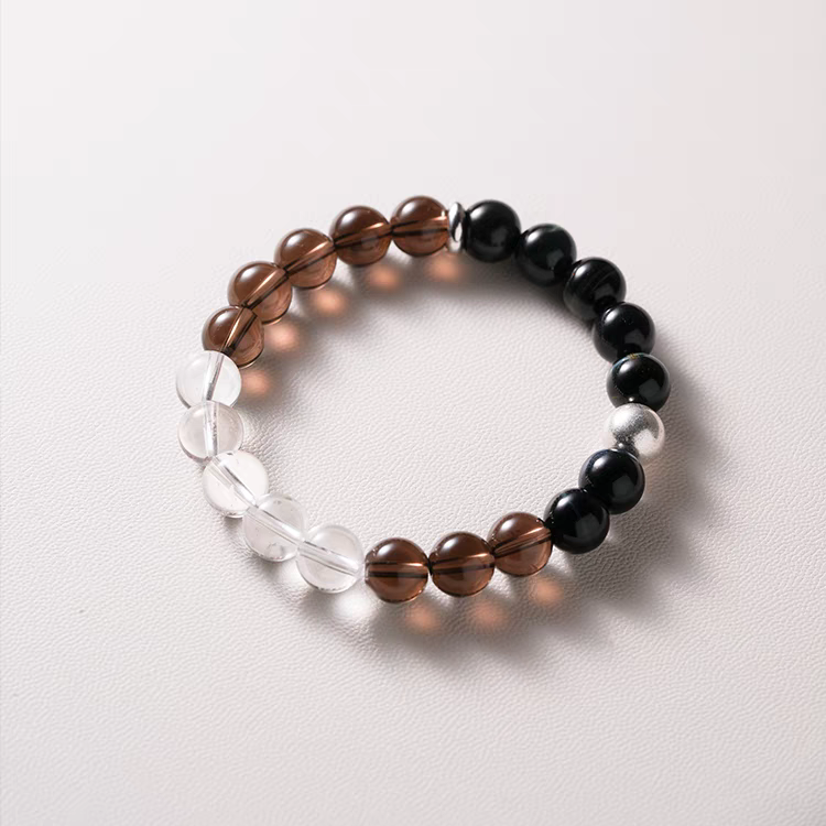 Detail of Black Tiger Eye and Crystal Healing Bracelet featuring gold accent beads for an elegant touch