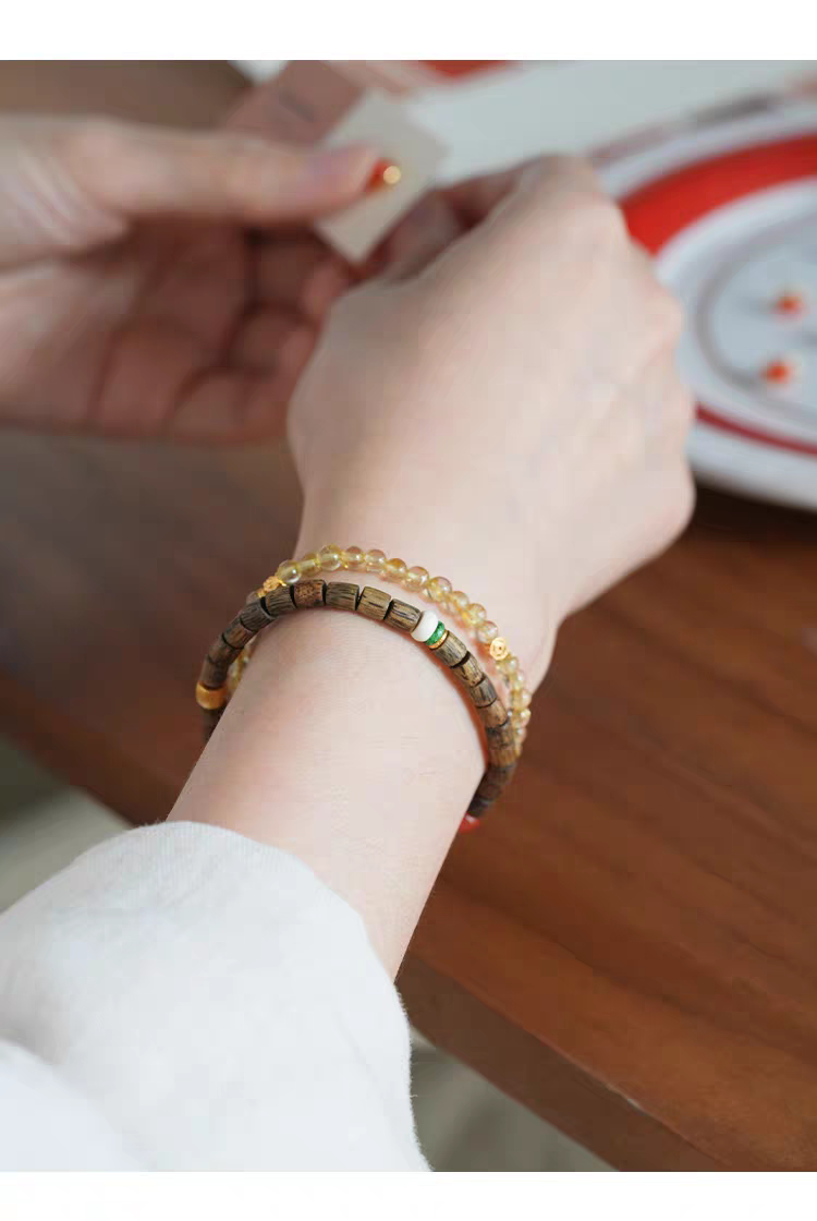 Qiū Shí Xù Feng Shui Bracelet worn on wrist, showcasing its handcrafted design and natural materials